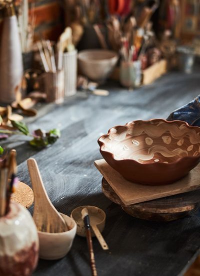 potter-hands-placing-painted-bowl-on-table-in-pott-resize-qswu640l3b1zl7ym1qu115ej54uon7r46mgiyfh7y4